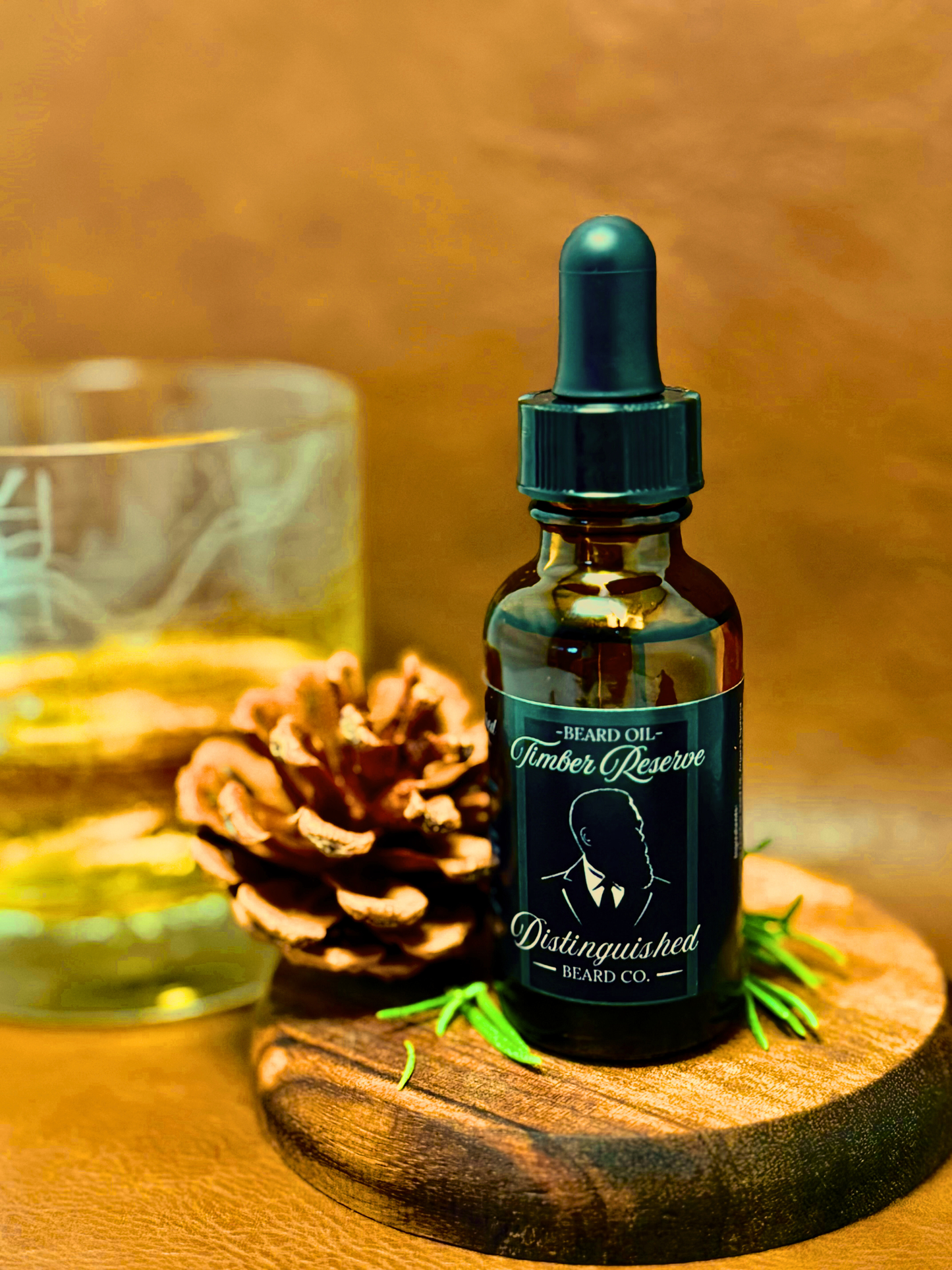 Bottle of Timber Reserve Distinguished Beard Oil on a wooden surface with a glass and pine cone in the background.