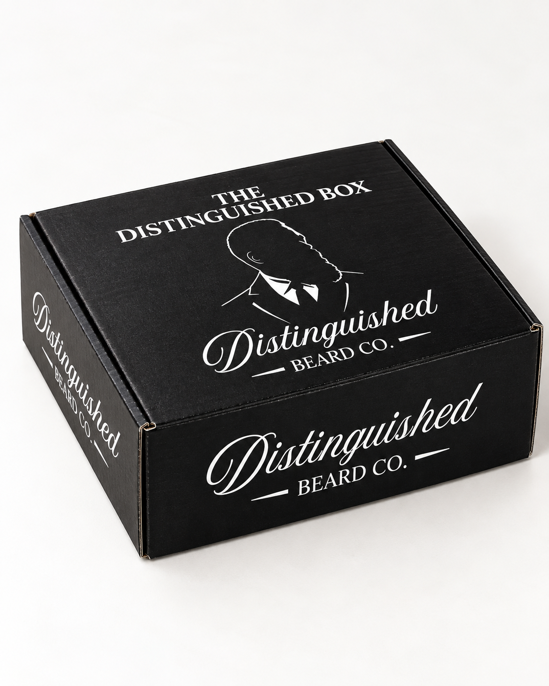 Distinguished Beard Co. black Distinguished Box with white branding, photographed at a three-quarter angle
