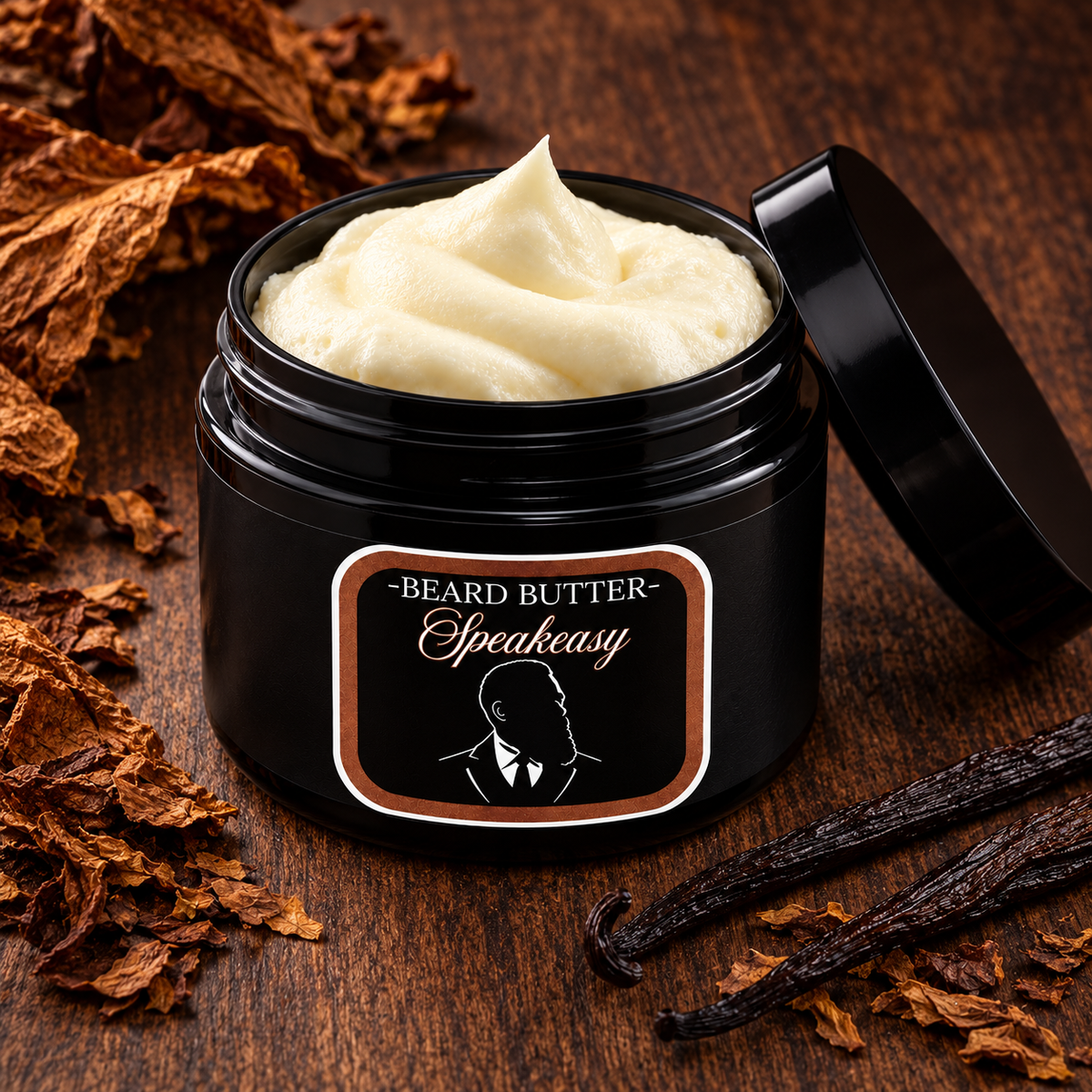 Distinguished Beard Co. Speakeasy Beard Butter, open container on dark wood with tobacco-and-vanilla inspired accents