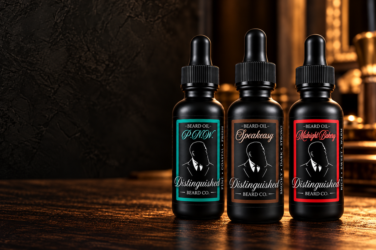 P.N.W. teal, Speakeasy dark brown, and Midnight Bakery red beard oil bottles on a walnut counter