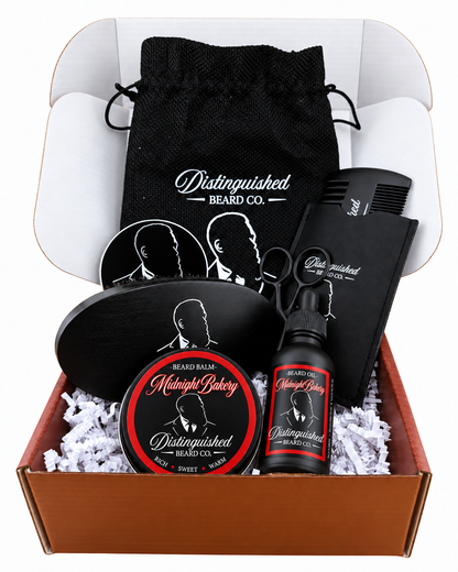 Distinguished Beard Co. Midnight Bakery Starter Box with matching red scent labels and black beard oil bottle